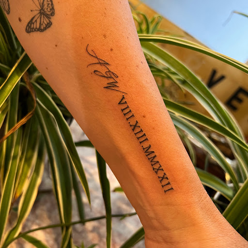 Explore cross tattoo ideas for woman, creative tattoo ideas in Buffalo, available at True Gloom Tattoo Studio
