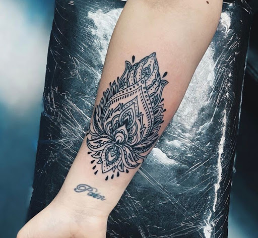 Explore guitar pick tattoo ideas, creative tattoo ideas in Florissant, available at St. Louis Ink