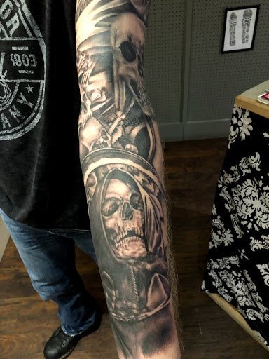 Find tattoo ideas for tummy tuck scars for your next unique tattoo in Kingsford at Deft Tattoo Studio