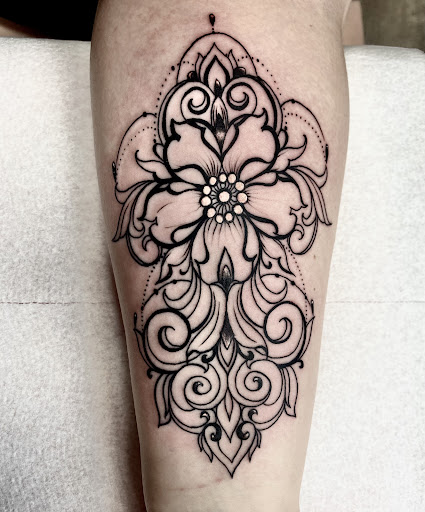 Explore august birth flower tattoo ideas, creative tattoo ideas in Lake City, available at Crooked Spines Tattoo Studio