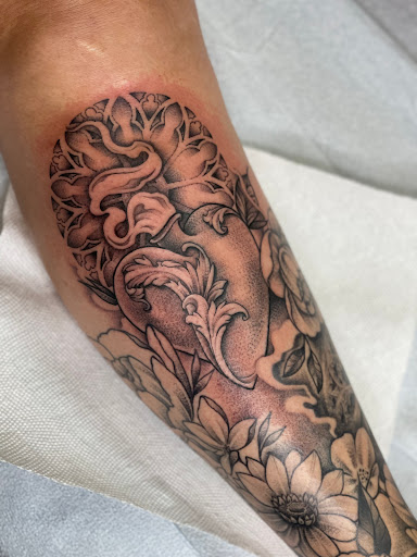 Find female rib tattoo ideas for your next unique tattoo in Lawrence at Black Chapel Tattoo