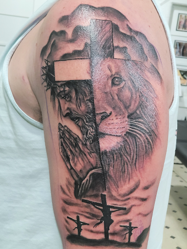 Explore muscle tattoo ideas, creative tattoo ideas in Evansville, available at Ink Therapy 101