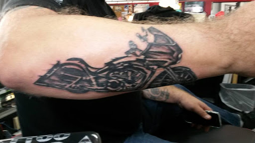 Explore astronaut tattoo ideas, creative tattoo ideas in Tucson, available at Tattoo Azteca Inc