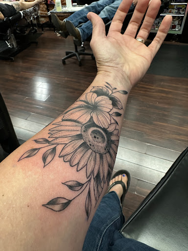 Explore mid arm tattoo ideas, creative tattoo ideas in Dubuque, available at The Crows Nest