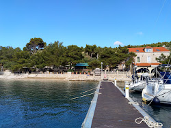 Porto Rosso beach'in fotoğrafı ve yerleşim
