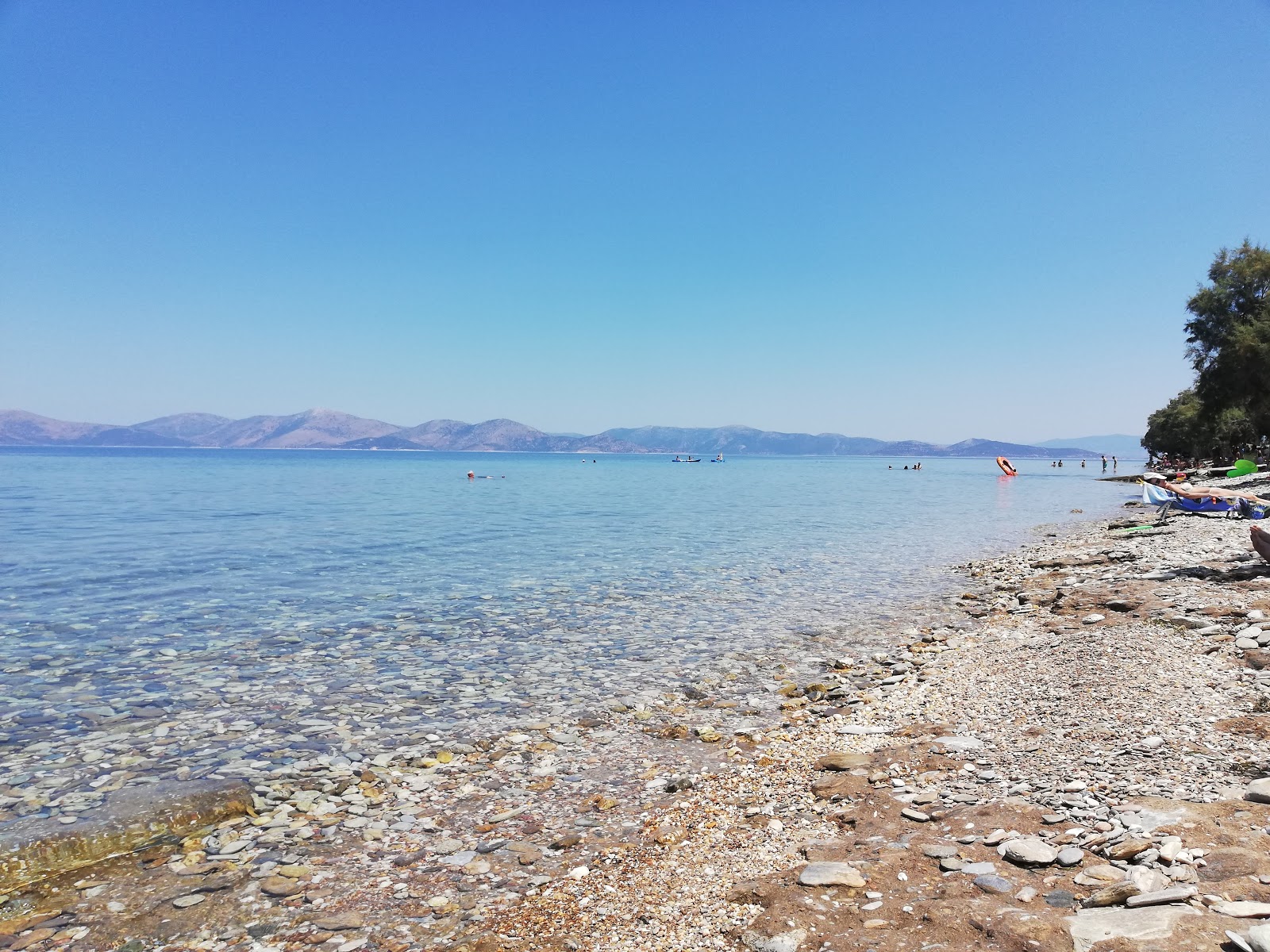 Foto von Sesi beach mit braune kiesel Oberfläche