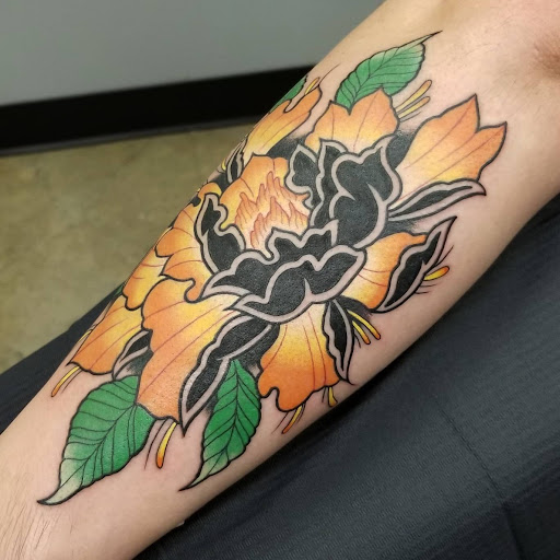 Explore tramp stamp cover up tattoo ideas, creative tattoo ideas in Painesville, available at The Inkwell Tattoo Company