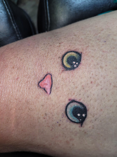 Explore rock n roll tattoo ideas, creative tattoo ideas in Angola, available at Hoodlum Ink