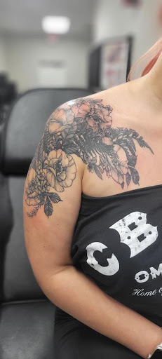 Explore women's sternum tattoo ideas, creative tattoo ideas in Ocala, available at Black Lotus Tattoo & Art Gallery Inc