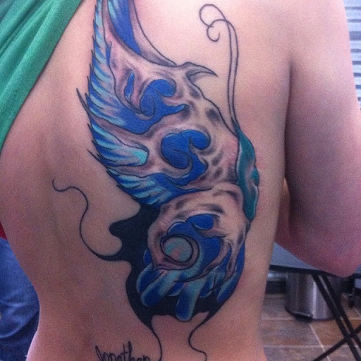 Find tattoo between breast ideas for your next unique tattoo in Nampa at Temptation Tattoo & Body Piercing