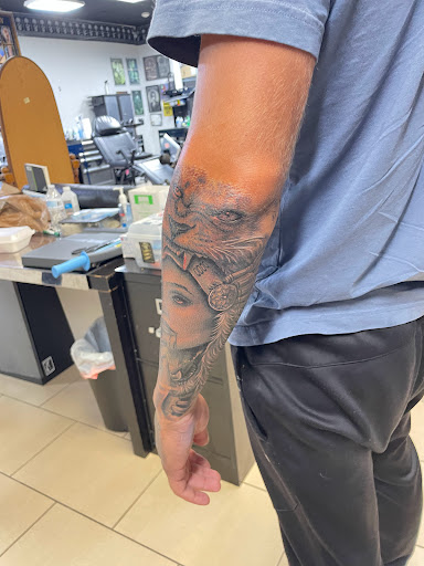 Explore small dragon tattoo ideas, creative tattoo ideas in Sarasota, available at SEVEN SINS Tattoo Studio