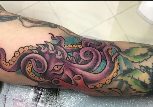 Explore tramp stamp tattoos ideas, creative tattoo ideas in Schaumburg, available at Atmosphere Tattoo Gallery - Schaumburg