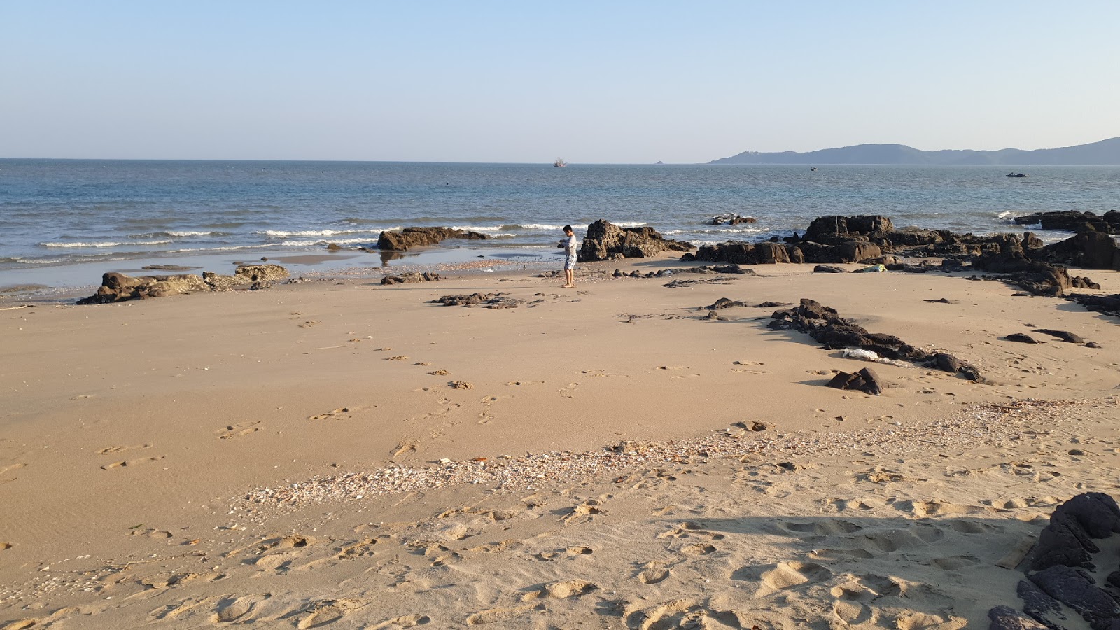 Foto av Black Rock Beach med lång rak strand