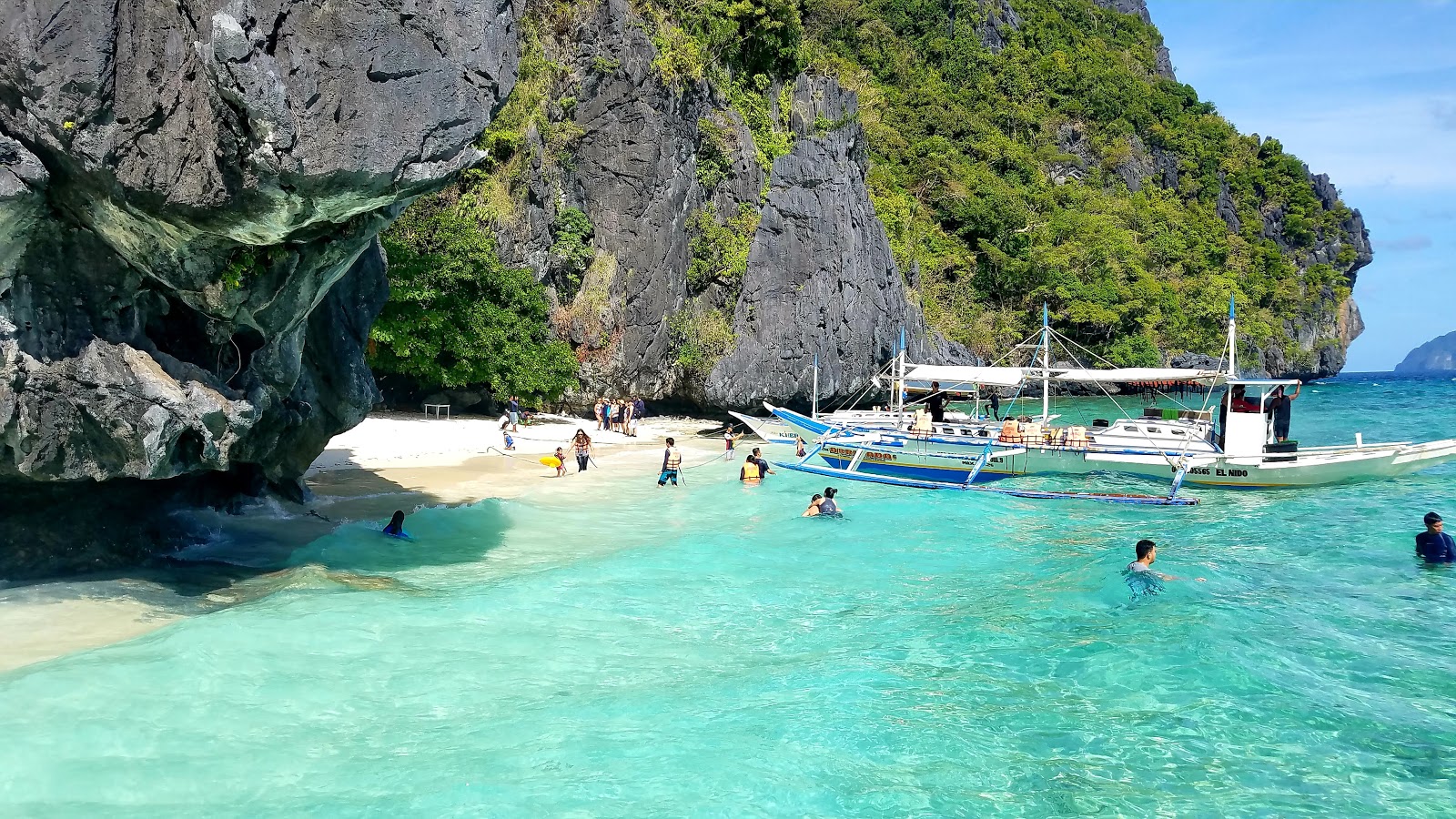 Photo of Entalula Beach with turquoise pure water surface