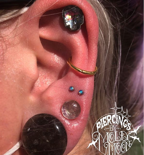 Explore fishnet tattoo ideas, creative tattoo ideas in Oshkosh, available at Piercings by Molly Moon at 920 Tattoo and Piercing