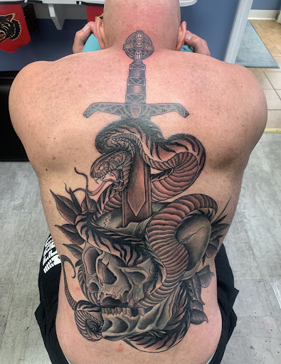 Find owl tattoo ideas for guys for your next unique tattoo in Erie at Code of Honor Tattoo