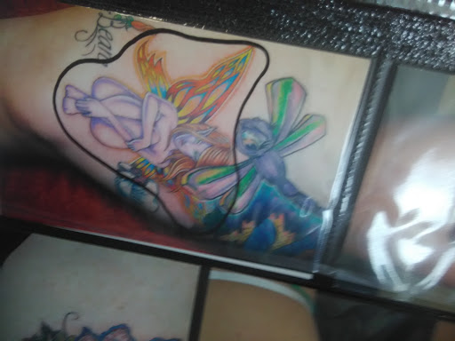Tattoo Shop «Looking Glass Tattoo & Gallery», reviews and photos, 2110 SW Brandywine Ln #140, Topeka, KS 66604, USA