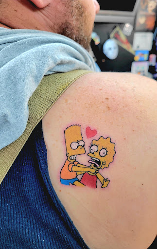 Explore half arm tattoo ideas, creative tattoo ideas in Benton, available at Spectrum Tattoo