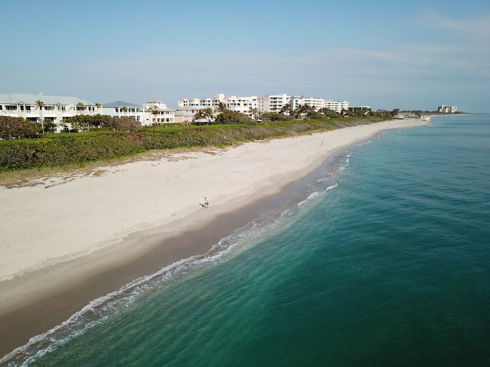 Foto av Jupiter Beach med beige sand yta