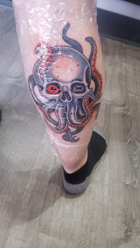 Explore dragon head tattoo ideas, creative tattoo ideas in Loveland, available at Satori Tattoo