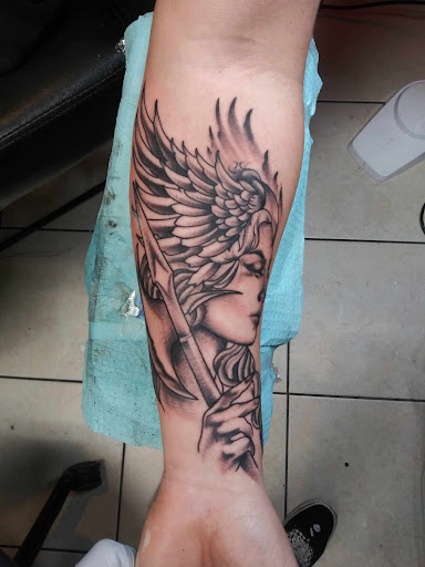 Explore red ink tattoo ideas, creative tattoo ideas in The Dalles, available at Tattooing by Denver Monaghan