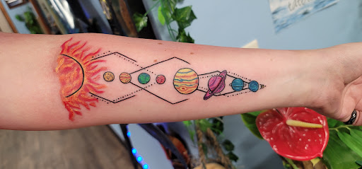 Explore tattoo ideas for top of leg, creative tattoo ideas in Forest Lake, available at Electric Blue Tattoo Co.