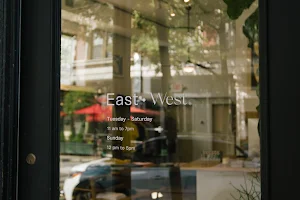 East • West image