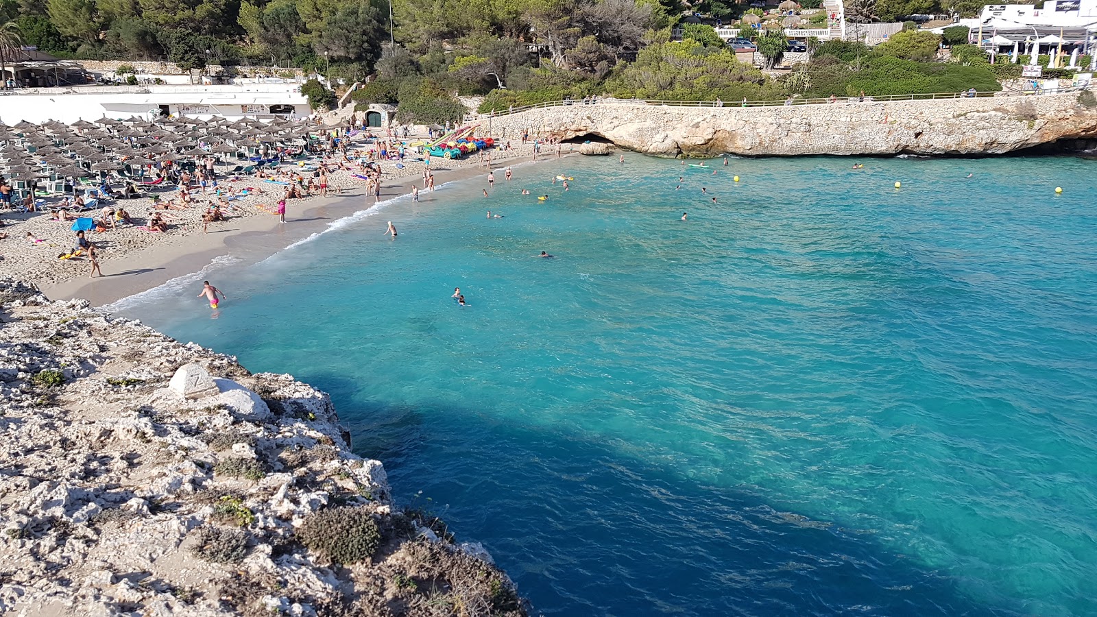 Photo of Cala domingos beach with turquoise pure water surface