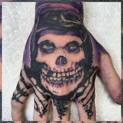 Explore face tattoo ideas black male, creative tattoo ideas in Augusta, available at Mr. Tattoo