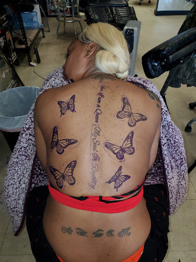 Explore full back tattoo ideas for men, creative tattoo ideas in Williamston, available at Lucky Tiger Tattoo studio