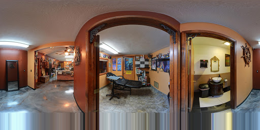 Explore under chin tattoo ideas, creative tattoo ideas in Charleston, available at Poor Boys Tattoo, LLC