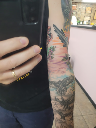 Explore happy tattoo ideas, creative tattoo ideas in New Orleans, available at TOUGH LOVE TATTOOS