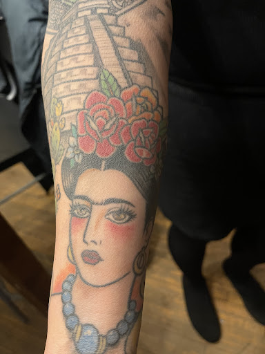 Explore rose tattoo ideas for females, creative tattoo ideas in Milwaukee, available at Speakeasy Tattoo Co