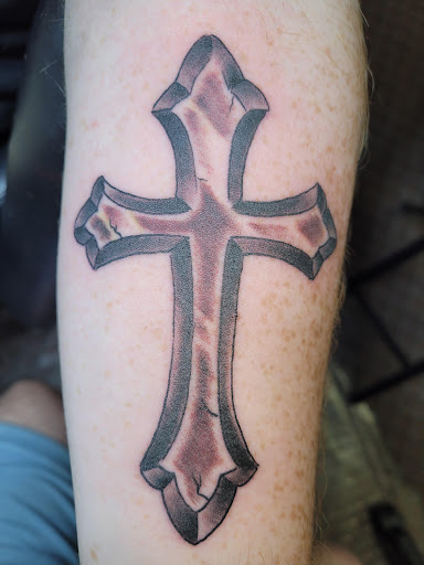 Explore one piece tattoo ideas for guys, creative tattoo ideas in Angola, available at Hoodlum Ink