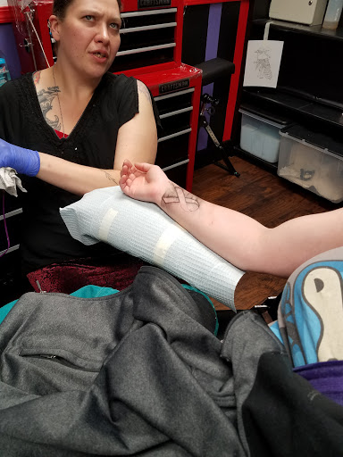 Explore wrestling tattoo ideas, creative tattoo ideas in Stayton, available at Sink-Ink