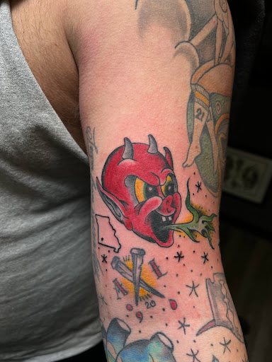 Explore skier tattoo ideas, creative tattoo ideas in Ozark, available at ChrisPeckTattoos