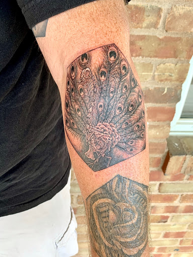 Explore ideas for leg tattoos, creative tattoo ideas in Powell, available at Elysium Body Enhancements