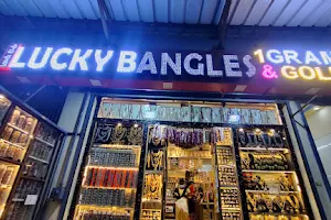 LUCKY BANGLES AND 1 GRAM GOLD Nellore image
