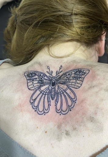 Explore deceased dog tattoo ideas, creative tattoo ideas in Orange, available at Smokin Irons Tattoo