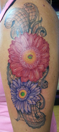 Explore birthday year tattoo ideas, creative tattoo ideas in Elkhart, available at Legendary Ink Tattoo and Piercing Studio