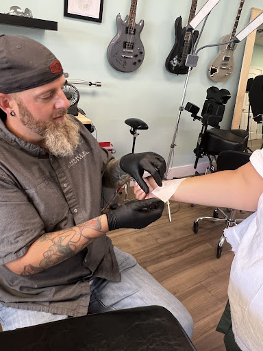 Explore forehead tattoo ideas, creative tattoo ideas in Cocoa Beach, available at 13 Waves Tattoo