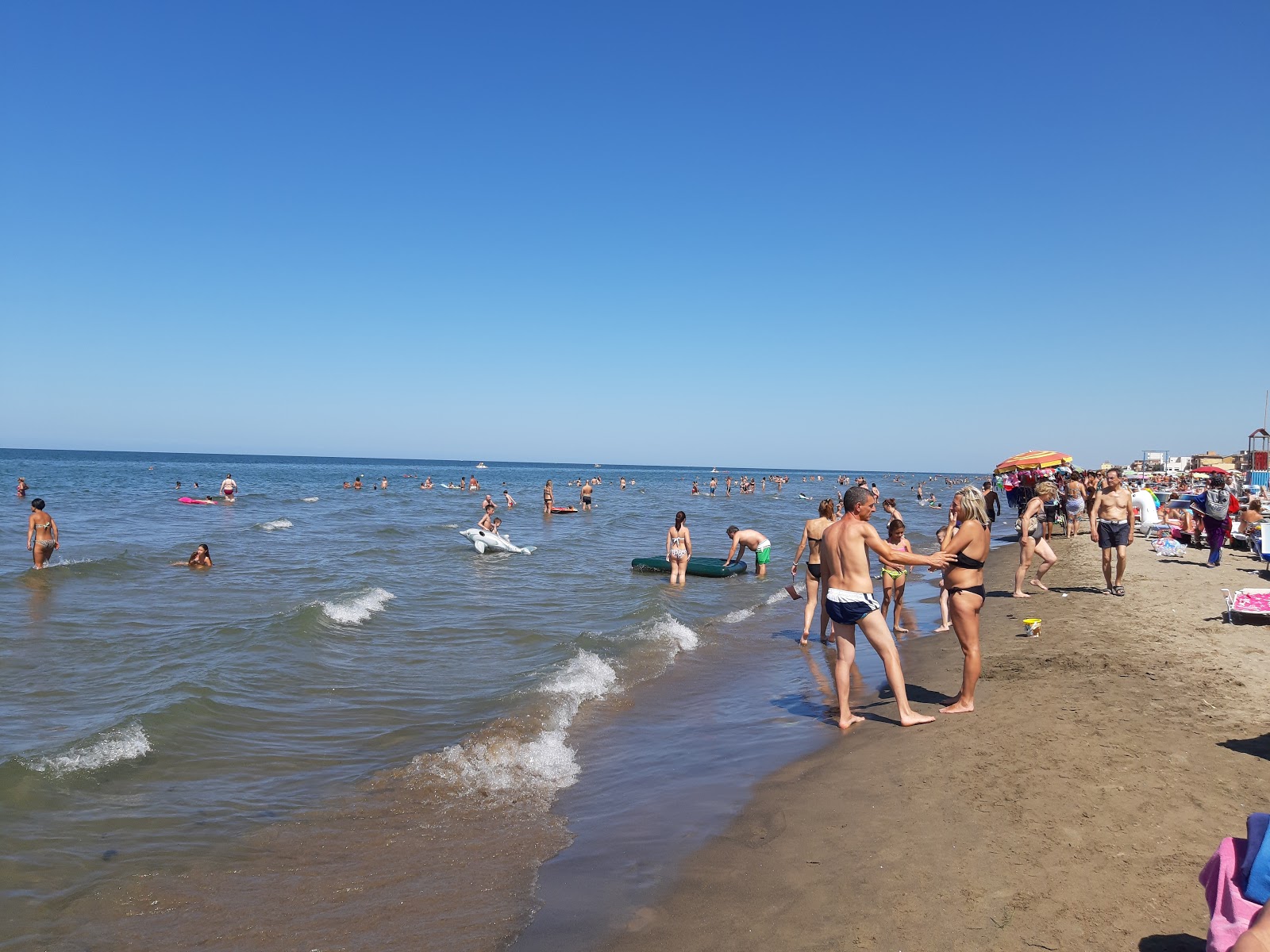 Fotografija Accesso Spiaggia Pappin z svetel pesek površino