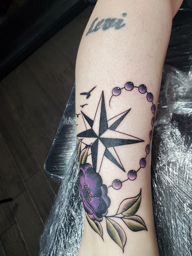 Explore floral sleeve tattoo ideas, creative tattoo ideas in Middletown, available at Traditionally Twisted Tattoo