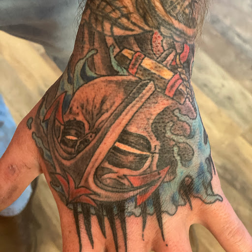 Explore gangster tattoo sleeve ideas, creative tattoo ideas in Pikeville, available at The Carbon Canary Tattoo Studio