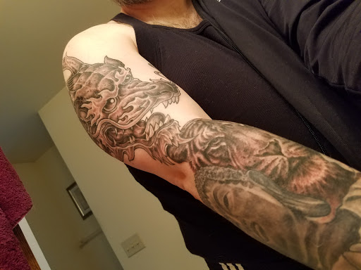 Explore back neck tattoo ideas, creative tattoo ideas in Waukesha, available at Waukesha Tattoo Company Galleria Edge