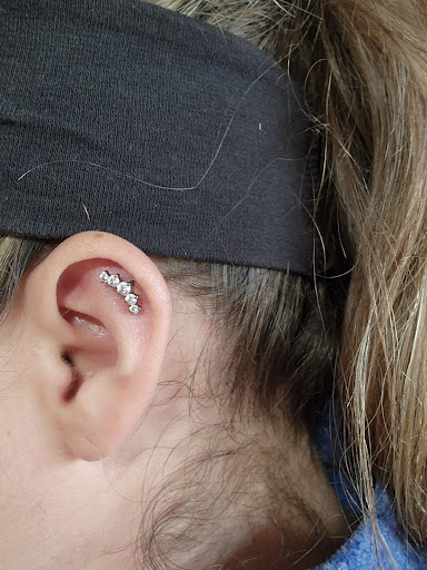 Explore small tattoo ideas behind ear, creative tattoo ideas in Toledo, available at Artistik Tat2 and Body Piercing