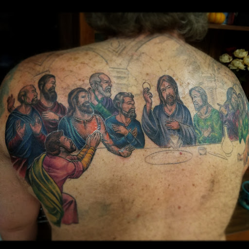 Explore gun tattoo ideas for men, creative tattoo ideas in Elizabeth City, available at Wolfs Den Custom Tattoo & Body Piercing Studio