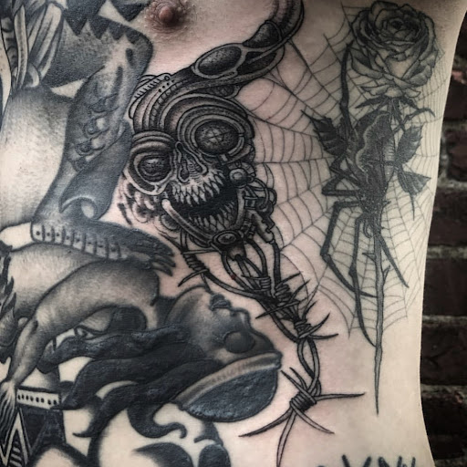 Explore puzzle tattoos ideas, creative tattoo ideas in Providence, available at The Torchbearer Tattoo