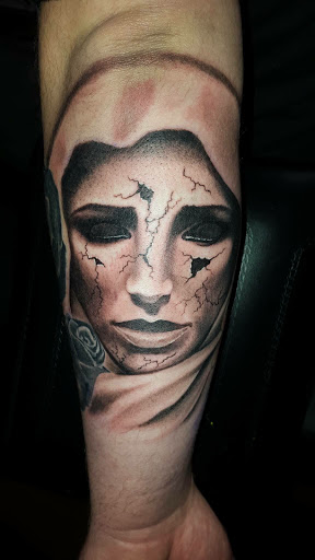 Explore law enforcement tattoo ideas, creative tattoo ideas in Roscoe, available at Elevated Ink Tattoo