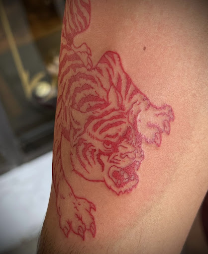 Explore inner ear tattoo ideas, creative tattoo ideas in Marietta, available at The Queen Bee Tattoo and Piercing Parlour